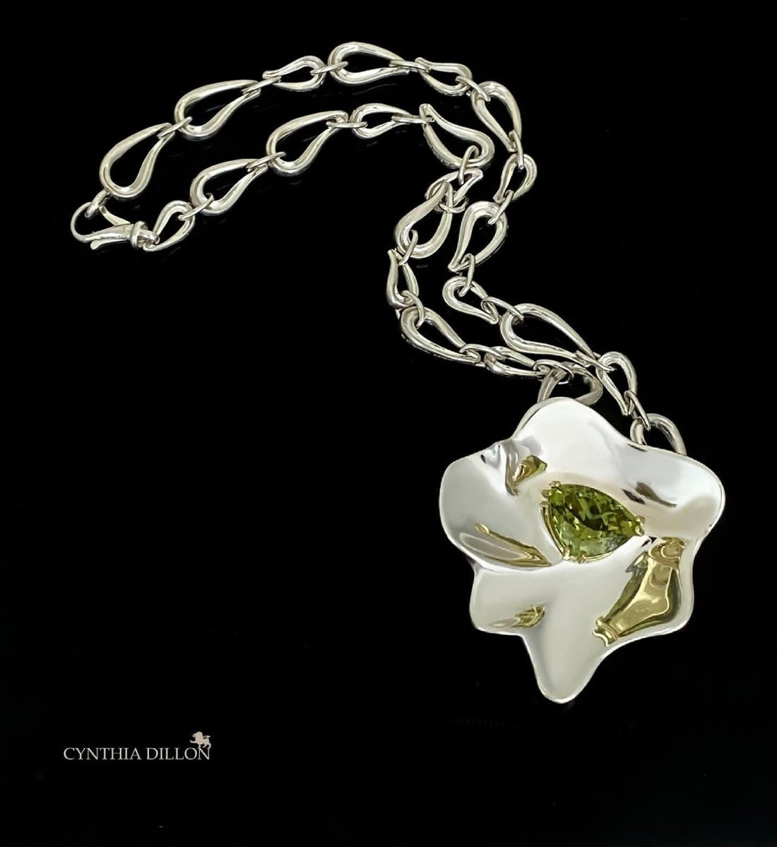 Rare 15.8 carat green garnet set in 18KTGold on sterling silver freeform flower