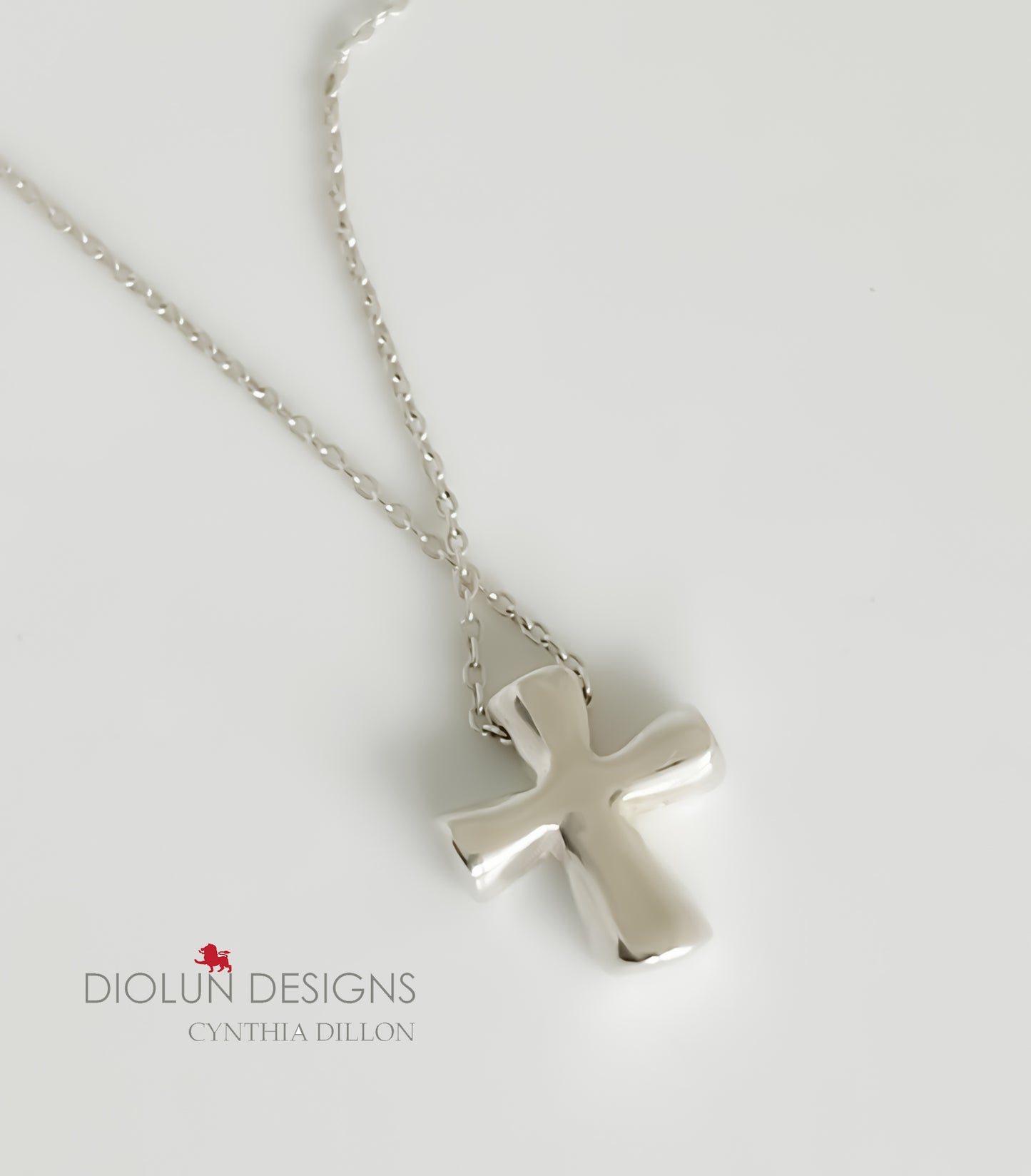 Pendant - Sculpted  "Solid Little Cross" in S/S w. 16" Chain.